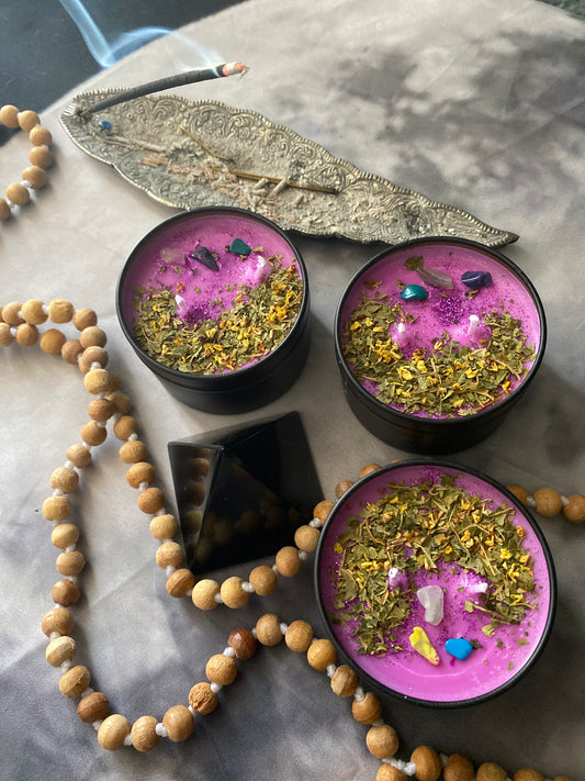 Protection Candle infused with sage, dragons blood Palo santo and Orange Bliss. Topped with herbs: papaya leaves and Osmanthus and crystals